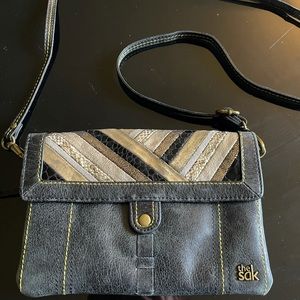 The Sak crossbody purse with multi-pattern stitching